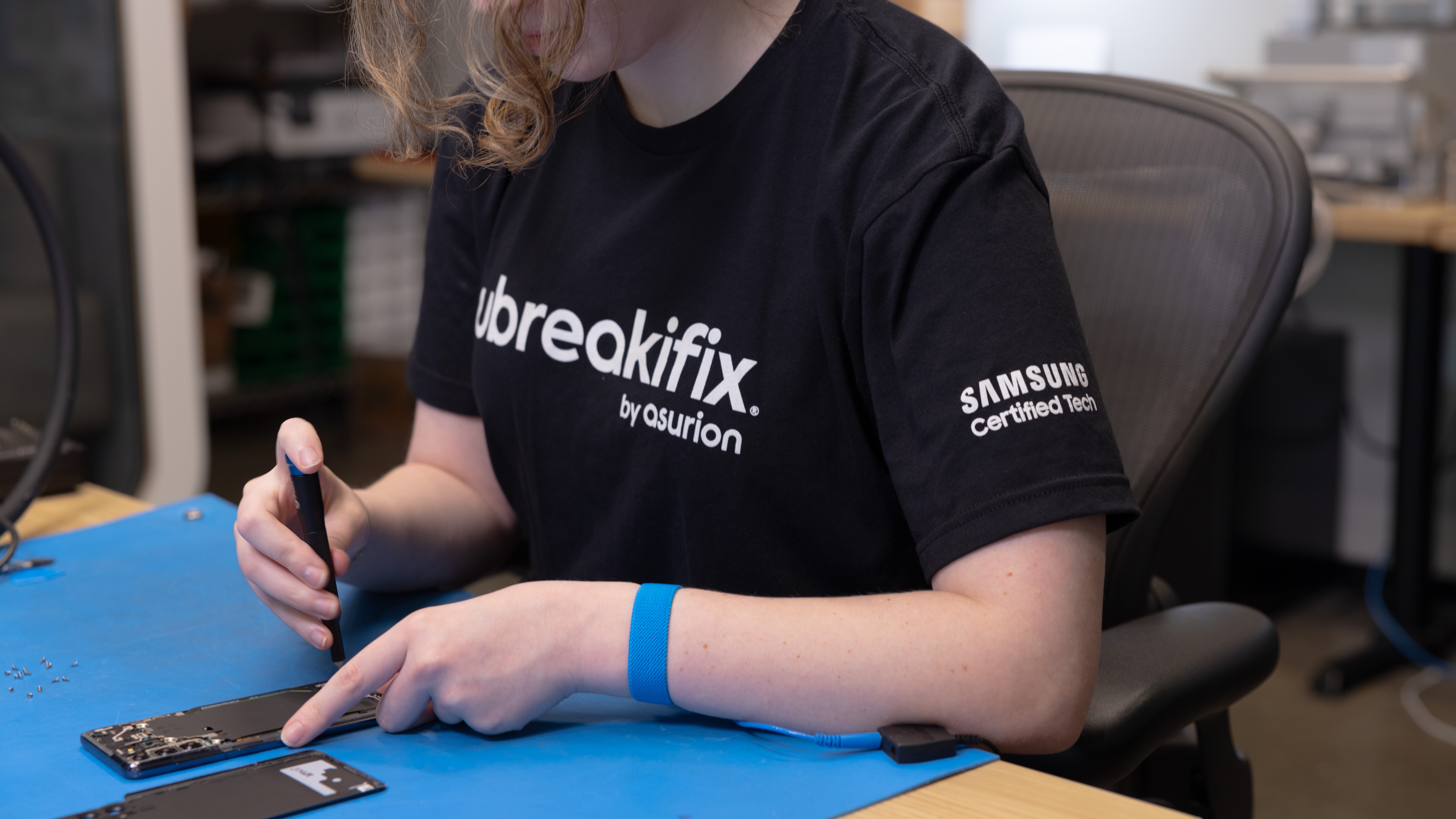 uBreakiFix by Asurion repair technician completing a Samsung Galaxy smartphone repair