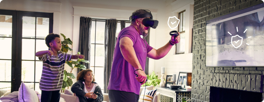 Father in virtual reality headgear with his son cheering him on