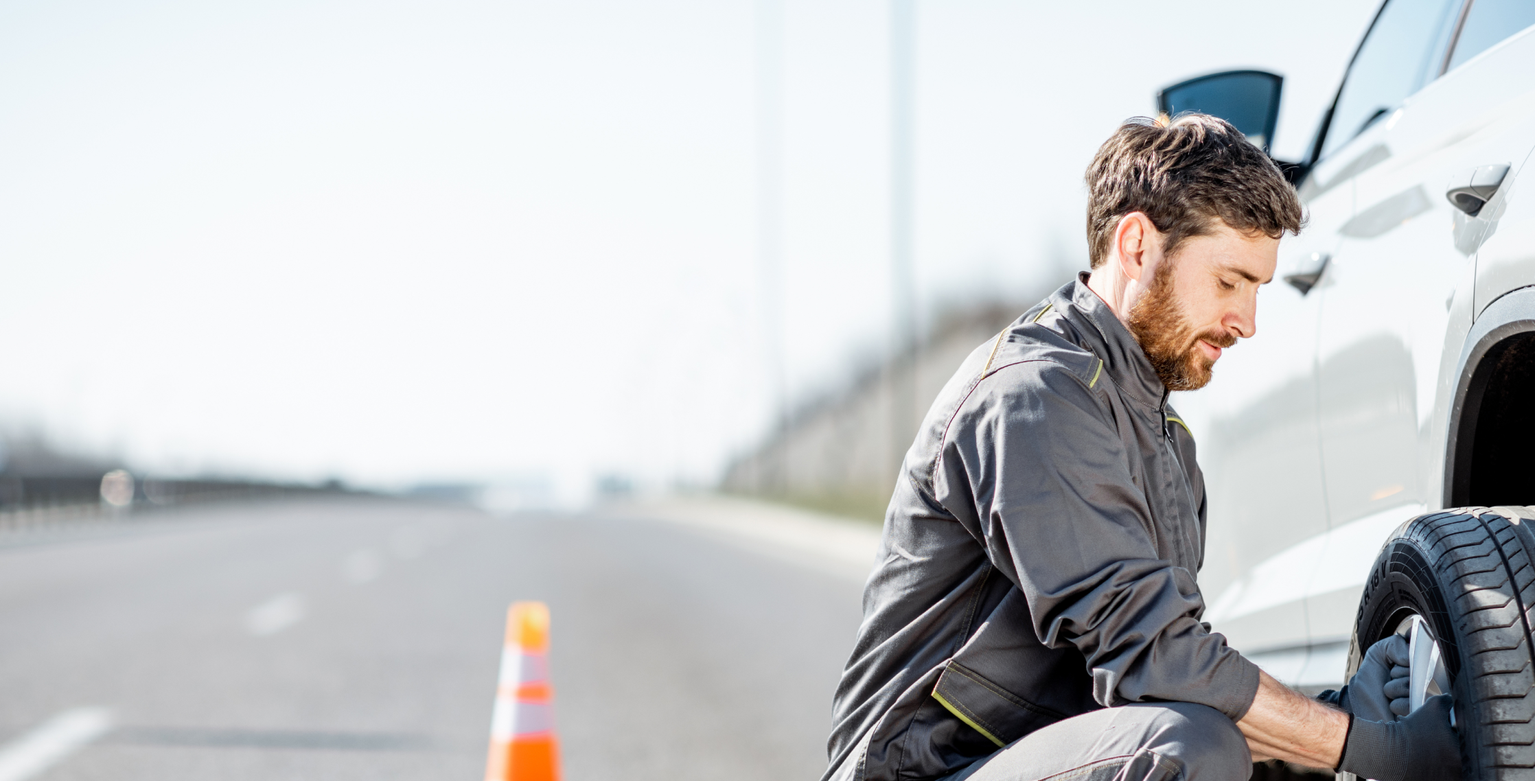 Mr. Rescue repairing vehicle on roadside