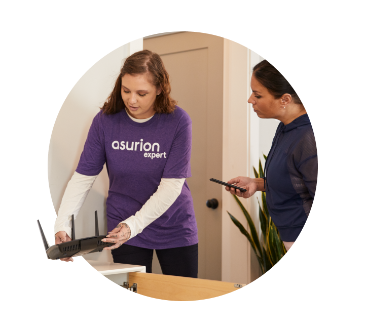 Woman assisting customer with setting up a router