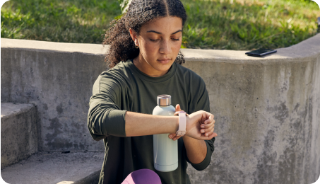 Woman checkers her smart watch