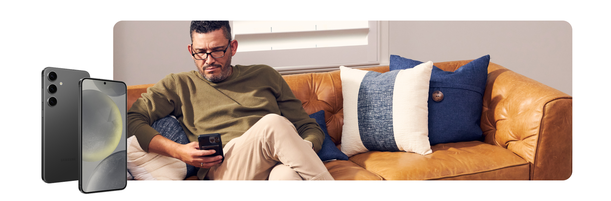 Man on couch using a phone