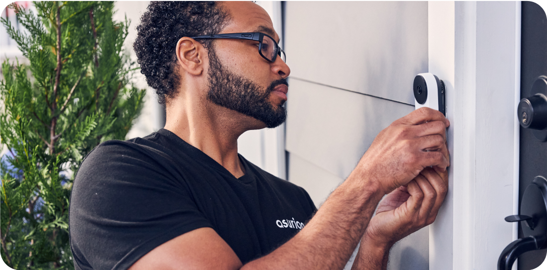 man installing doorbell tech