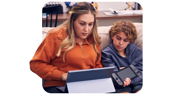 woman and child looking at devices